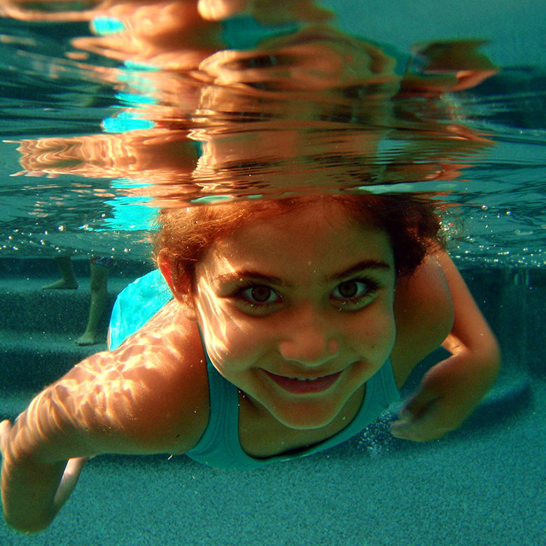 Girl Swimming Towards the Camera