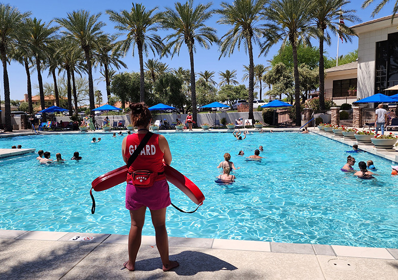 Lifeguard looking over a pool party