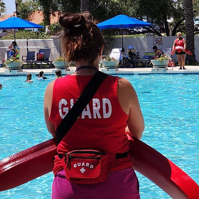 Certified Lifeguards Watching Over a Pool Party