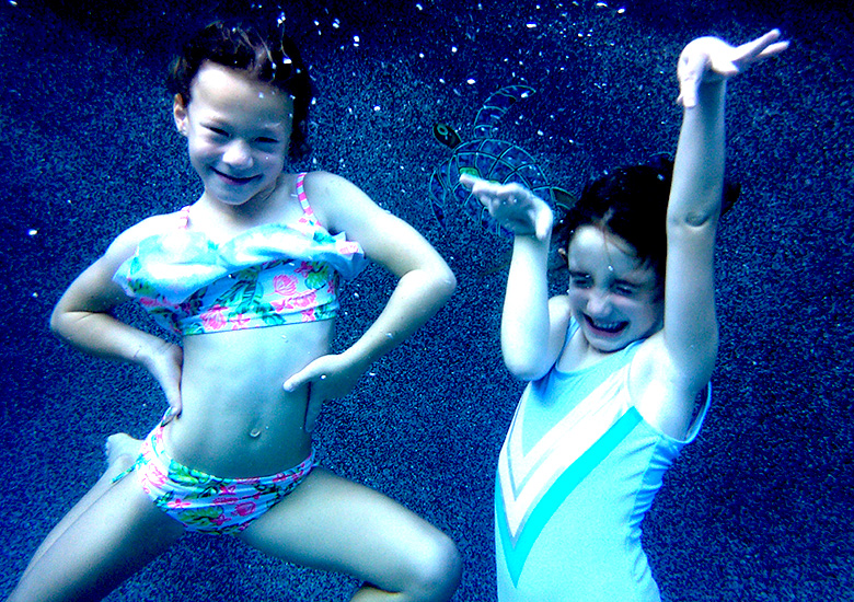 Two Girls Posing Under Water